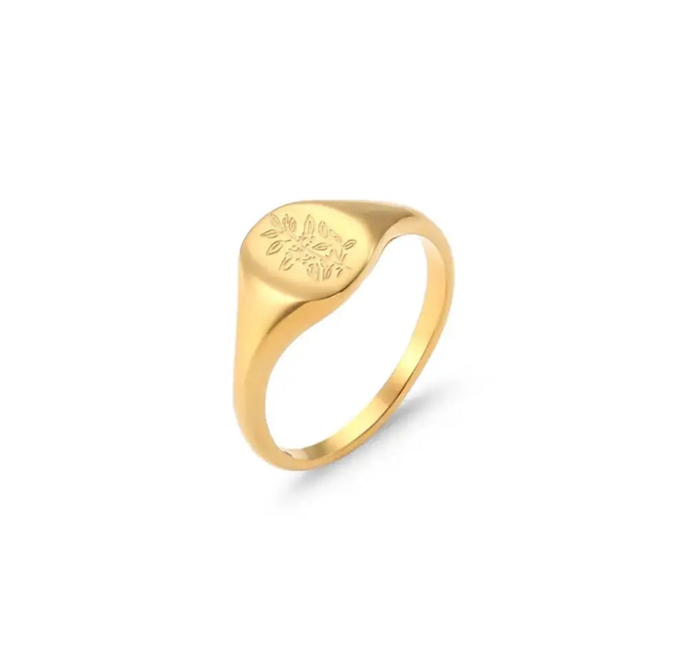 Wildflower engraved gold signet ring set featuring a delicate floral engraving on a smooth rounded face