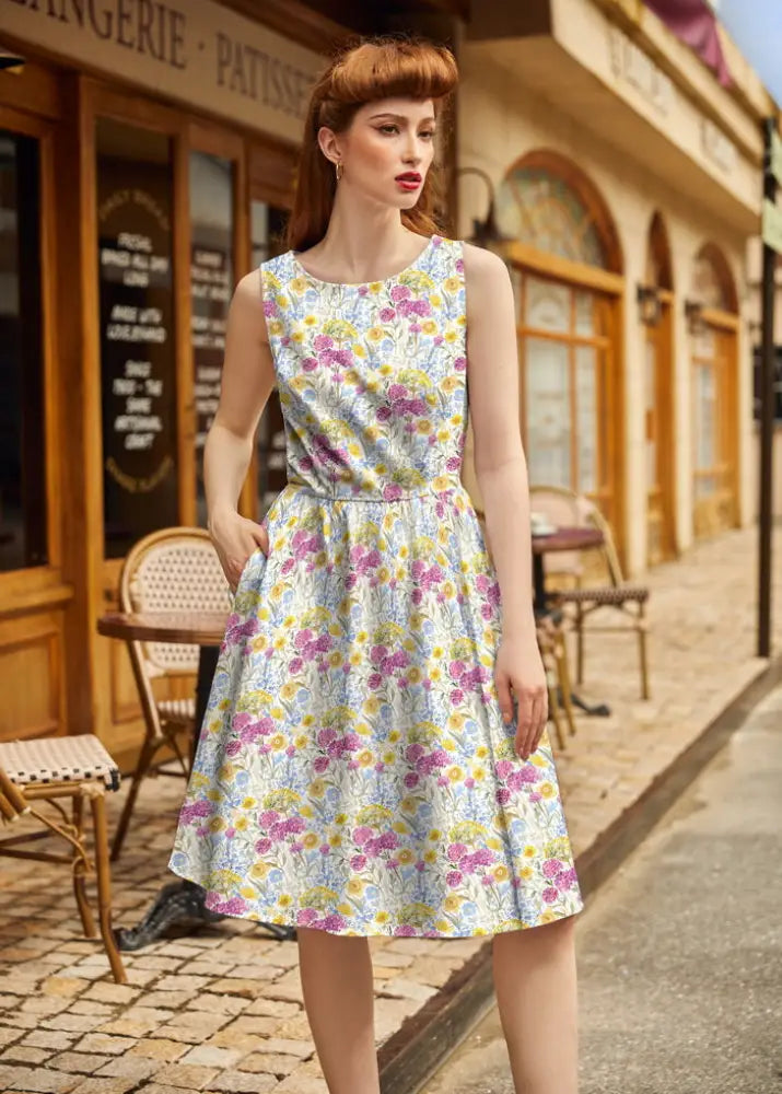 Wildflower vintage 1950s sleeveless cotton floral midi dress in light blue with pink and yellow blossoms and pockets
