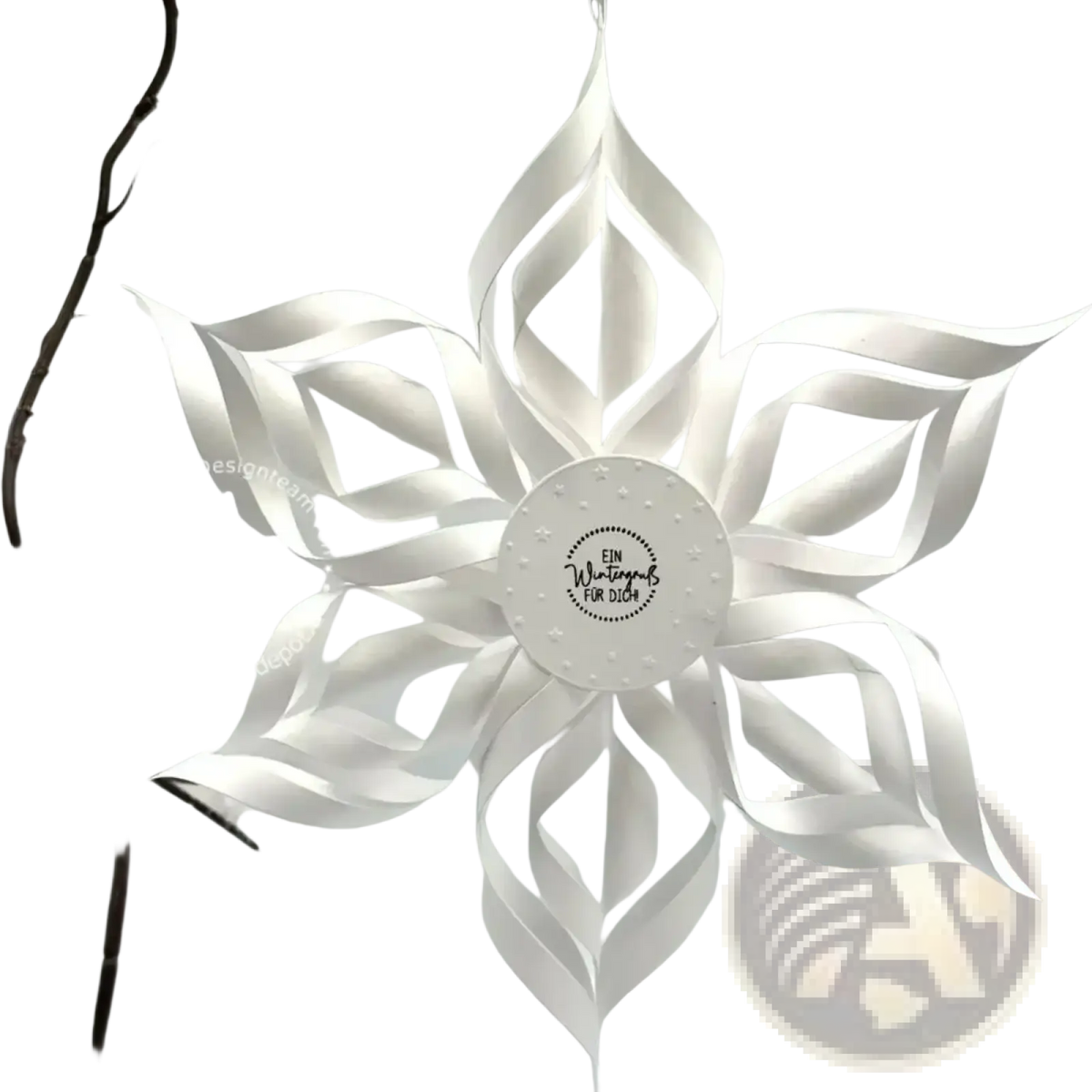 A delicate white paper snowflake ornament with intricate folds created using winter animal metal cutting dies for scrapbooking