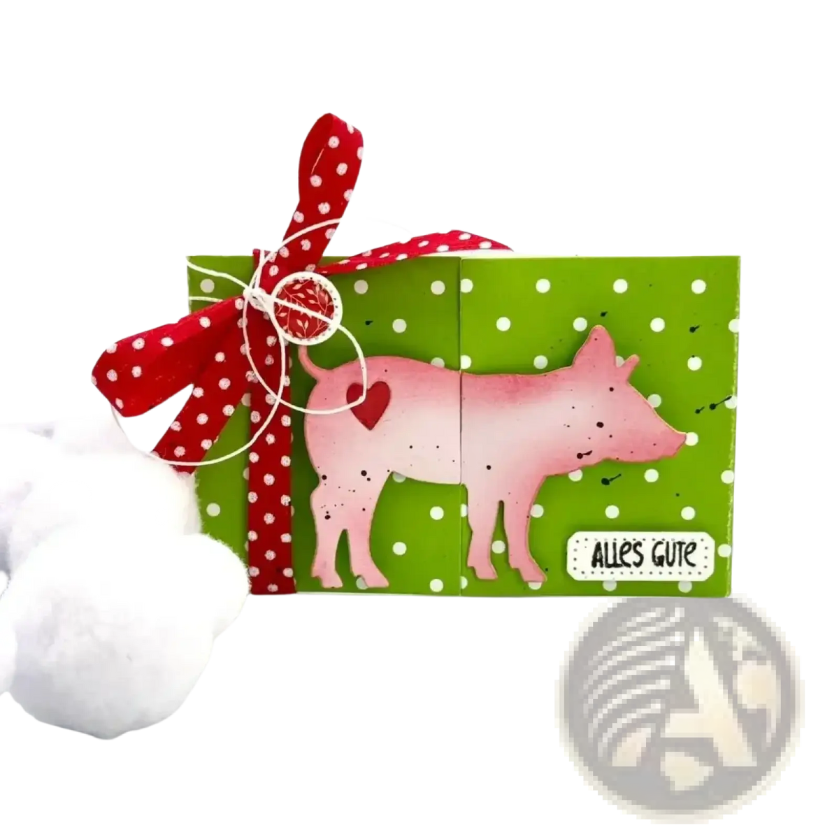 Winter animal metal cutting dies featuring a pink pig-shaped paper craft with speckled finish and red ribbon detail