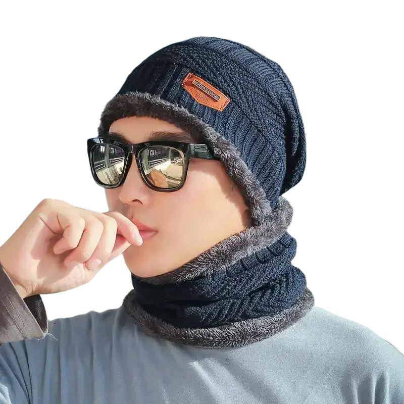 Dark blue knitted winter beanie with fuzzy gray lining and orange brand patch from the official website