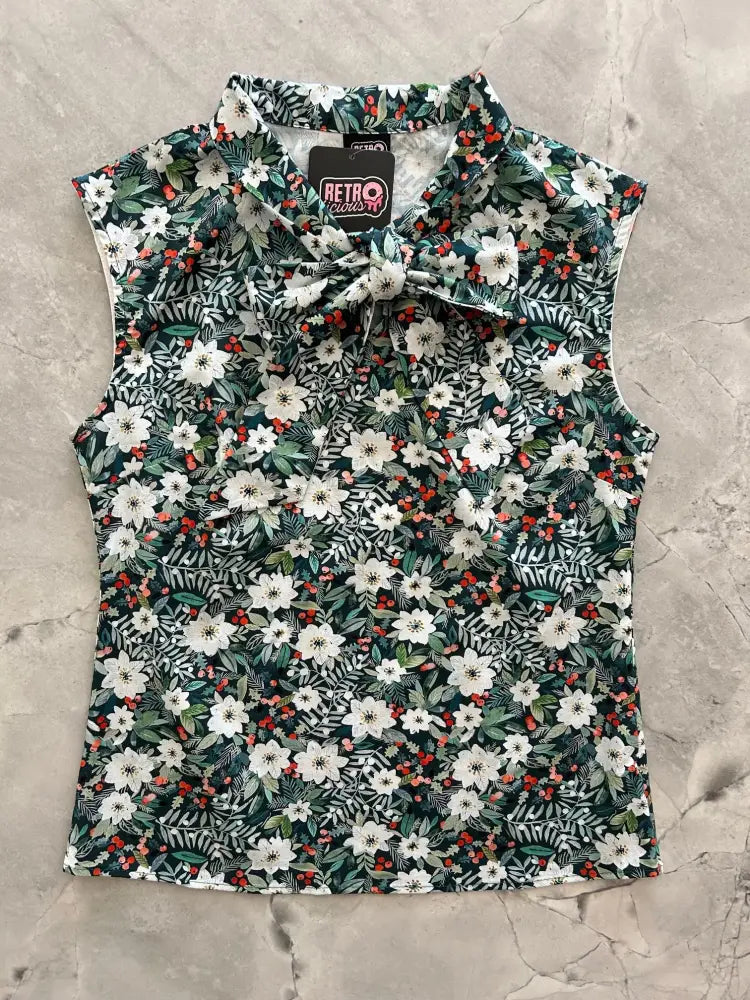 Winter floral sleeveless cotton bow blouse with white flowers green leaves and red berries on dark green background