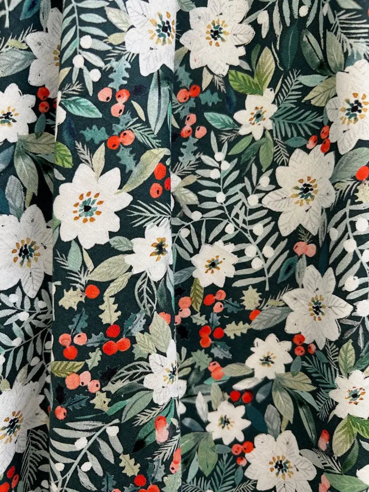 Dark green cotton winter floral Doris retro midi skirt with pockets featuring white blossoms red berries and leaves