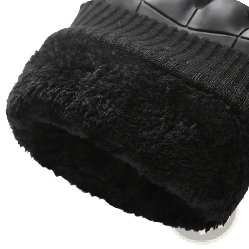 Black knit beanie with plush fleece lining designed for thermal windproof winter motorcycle riding gear