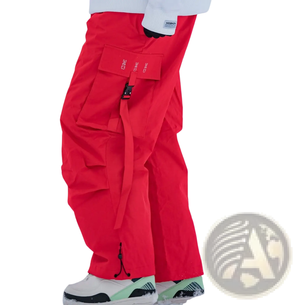 Winter outdoor loose ski pants in bright red durable waterproof material with multiple cargo pockets and black buckle closure