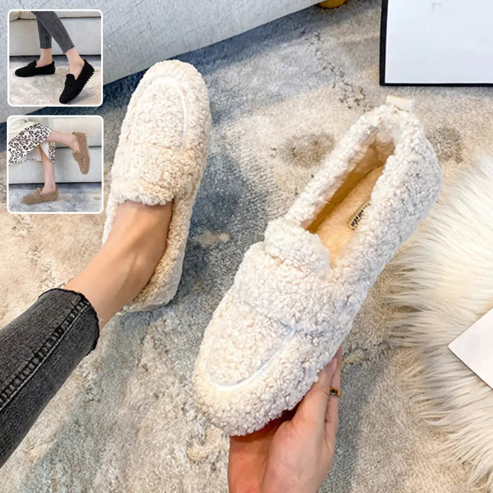 Cream-colored plush faux shearling winter loafers with a soft textured exterior and sheepskin-lined interior