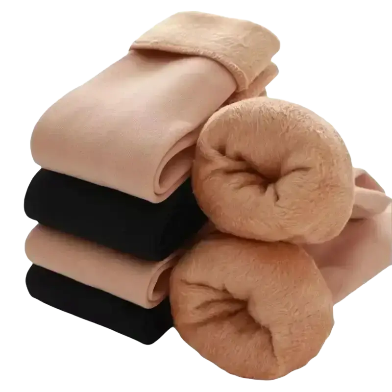 Stack of beige and black winter thermal socks with fleece lined cashmere wool and plush soft fuzzy texture