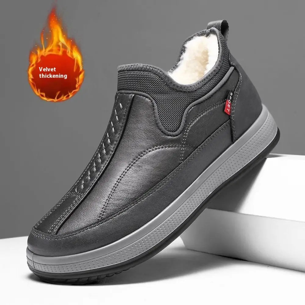 Men’s fleece lined slip on winter snow boots in dark gray with plush white lining and textured leather upper