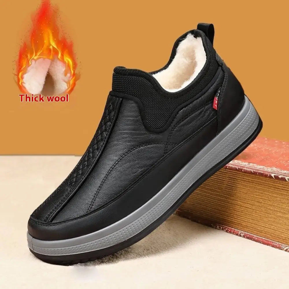 Men’s fleece lined slip on winter snow boots in black with plush white wool lining and gray rubber sole