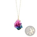 Wire wrapped rainbow quartz crystal pendant necklace with a vibrant pink to blue gemstone on a gold chain