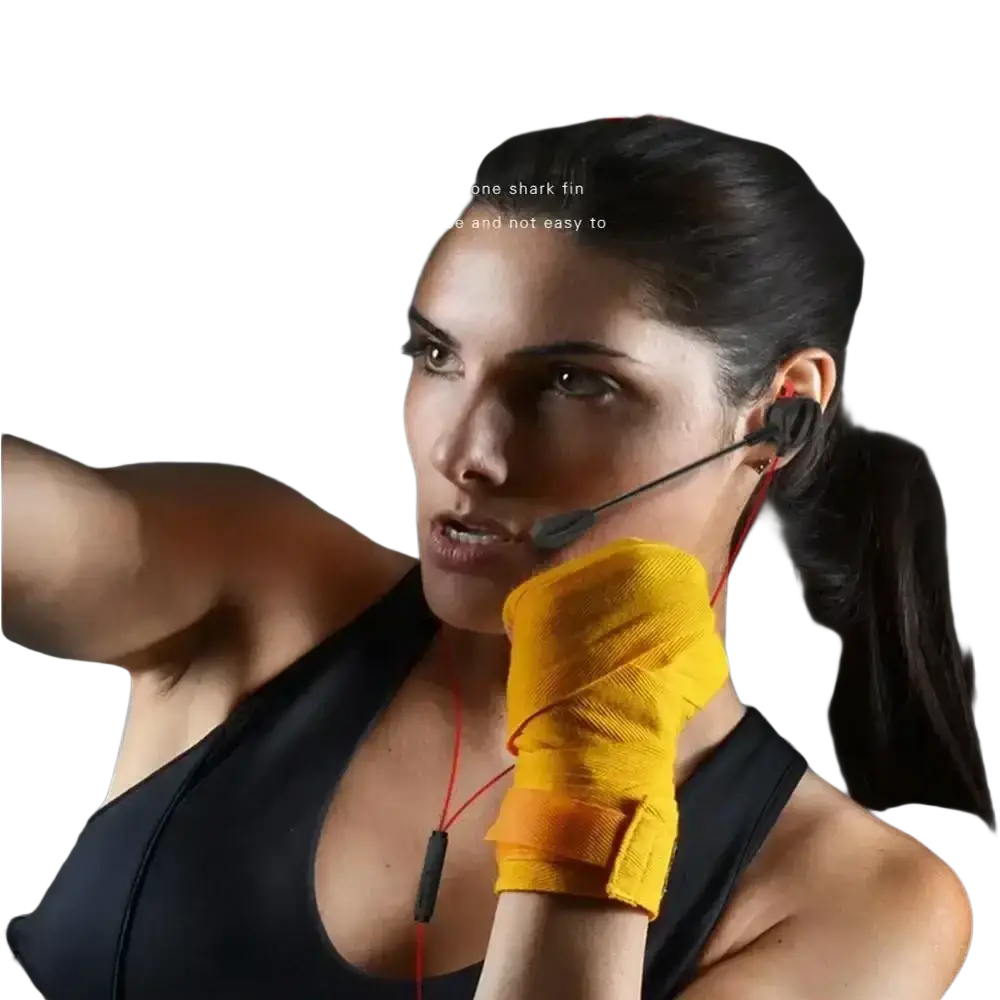 Red wired in-ear gaming headset with silicone shark fin ear supports and microphone boom for comfortable wear during exercise