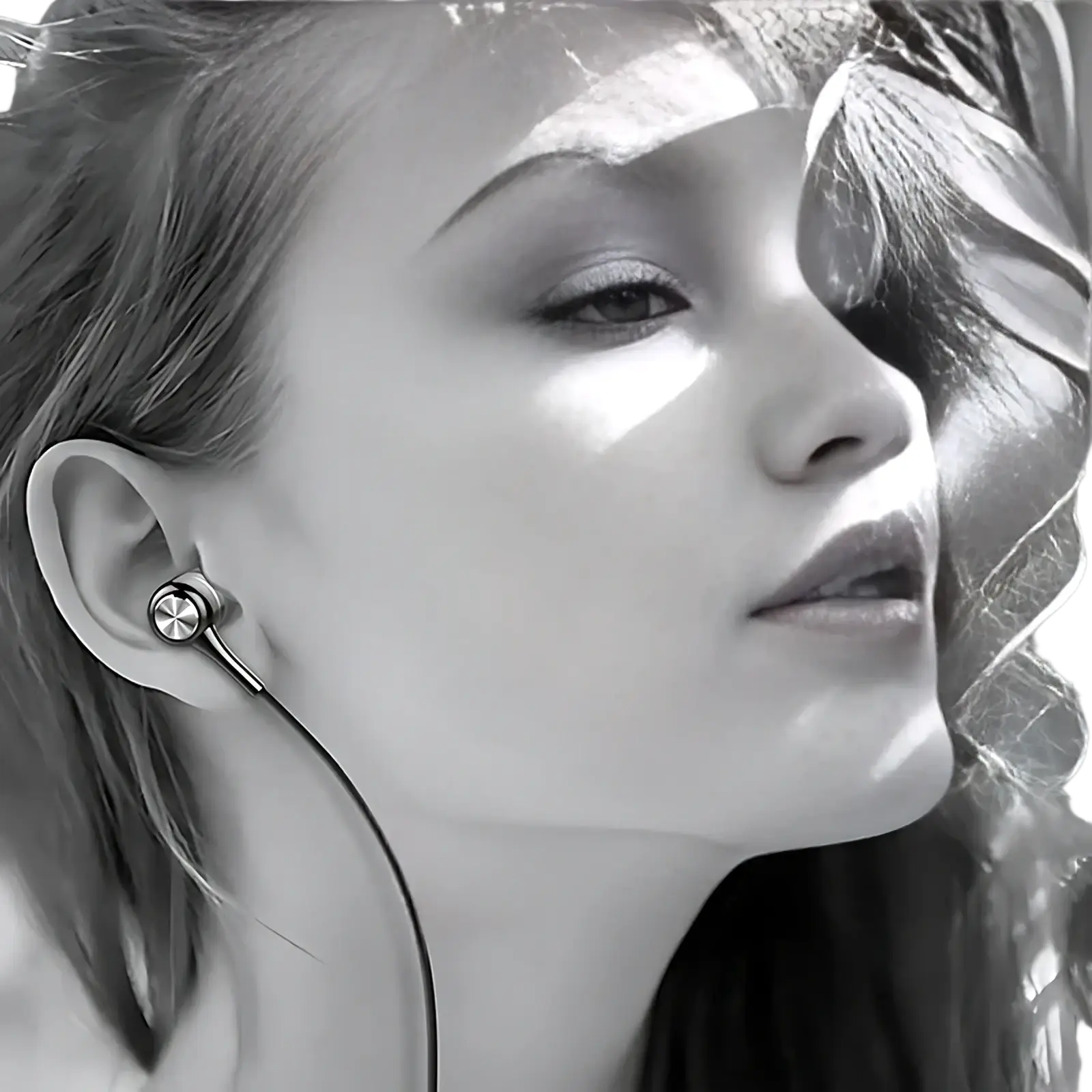 Silver wired earbuds hifi bass headset with mic featuring a sleek metallic finish and thin cable for clear audio