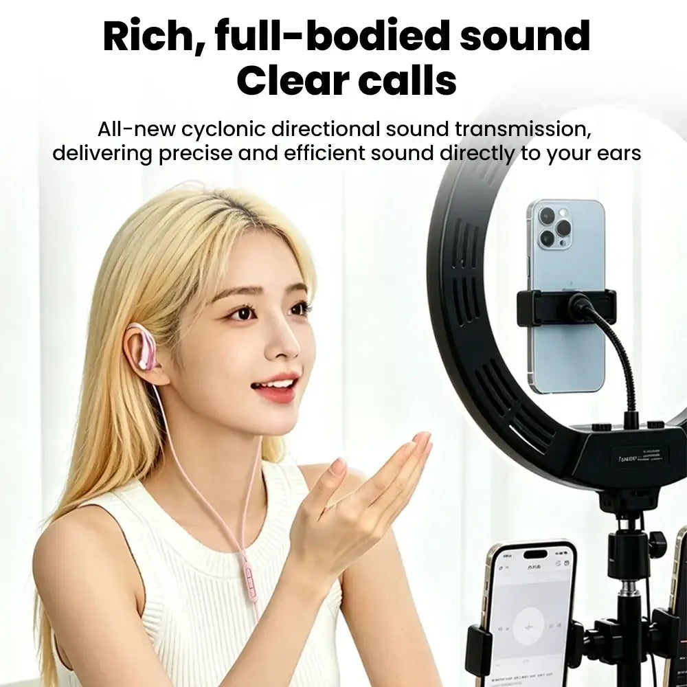Pink wired open ear headphones with volume control feature and matching neckband in a sleek soft-touch finish