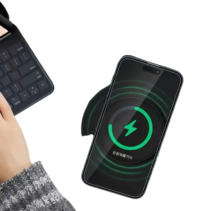 Black smartphone with sleek glossy finish on 15w magnetic wireless charger for fast desktop charging