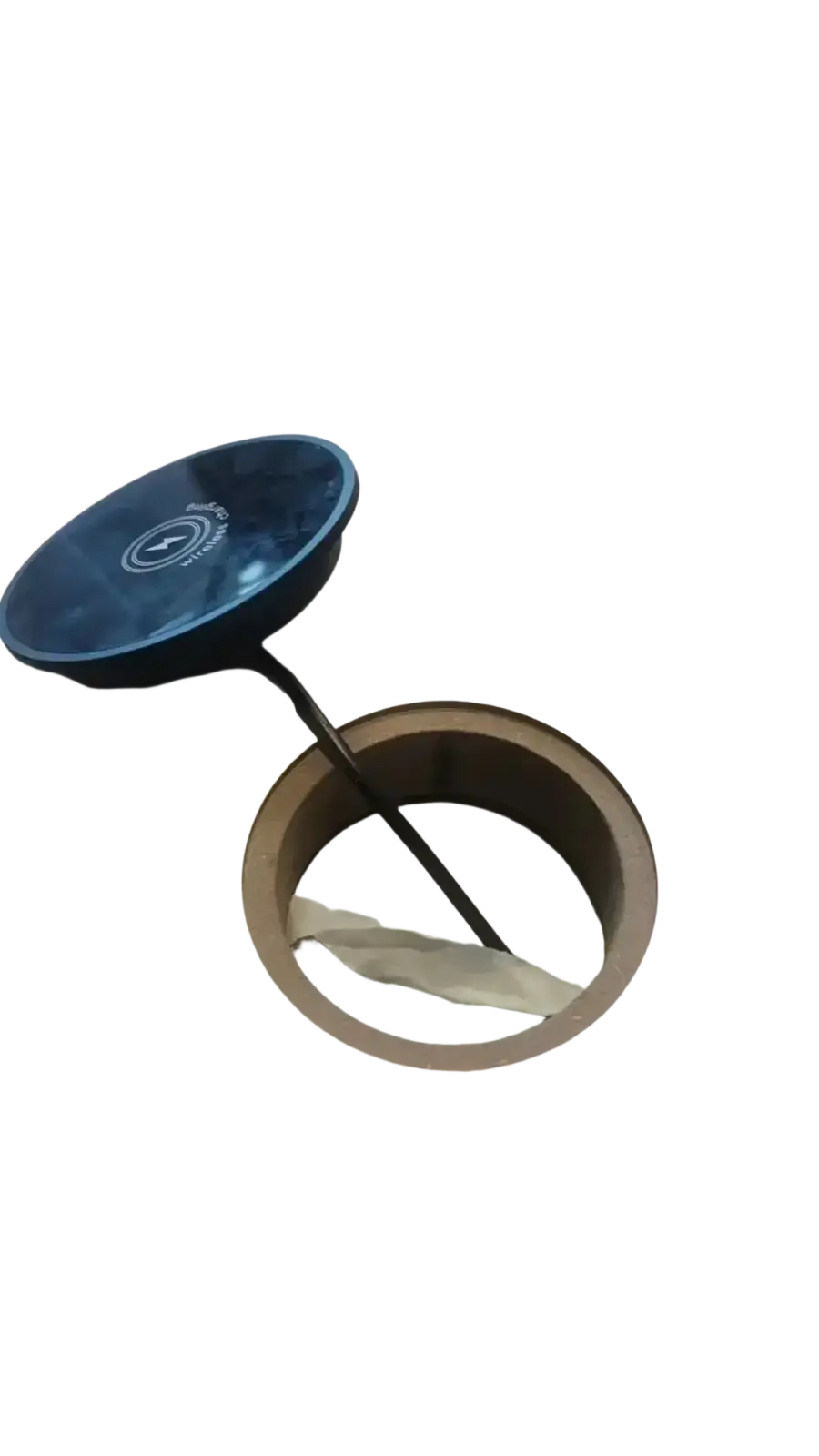 Blue circular lid with white logo atop beige cylindrical 15w magnetic wireless charger with smooth surfaces and metallic accents