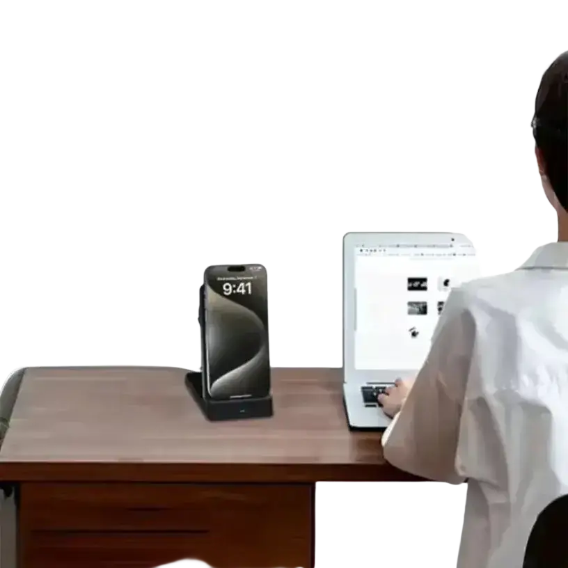 Black iphone 14 pro upright in a sleek black wireless charger 15w magnetic foldable phone stand on wooden desk