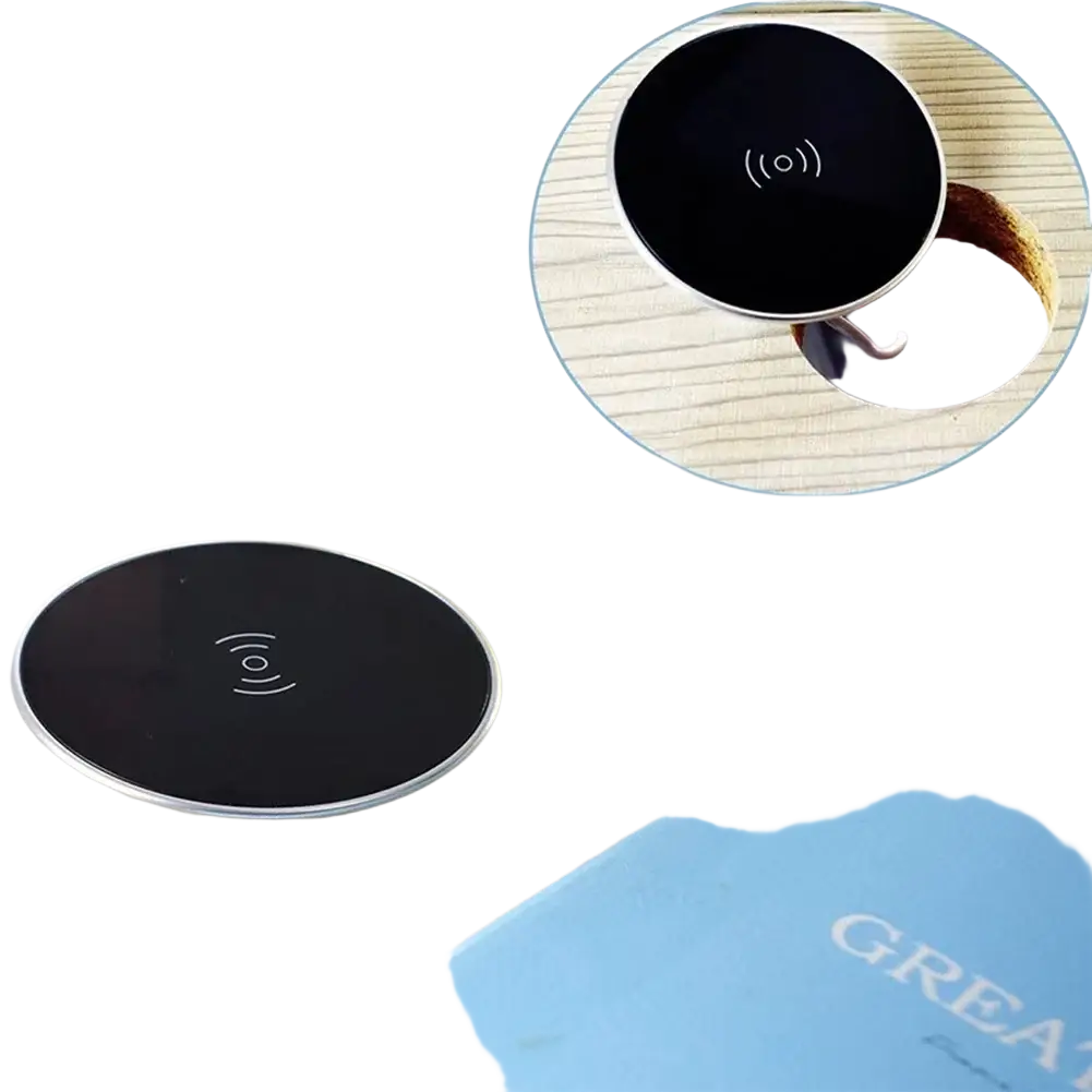 Ultra-thin circular wireless charger with sleek black surface and silver metallic rim for desktop fast charging