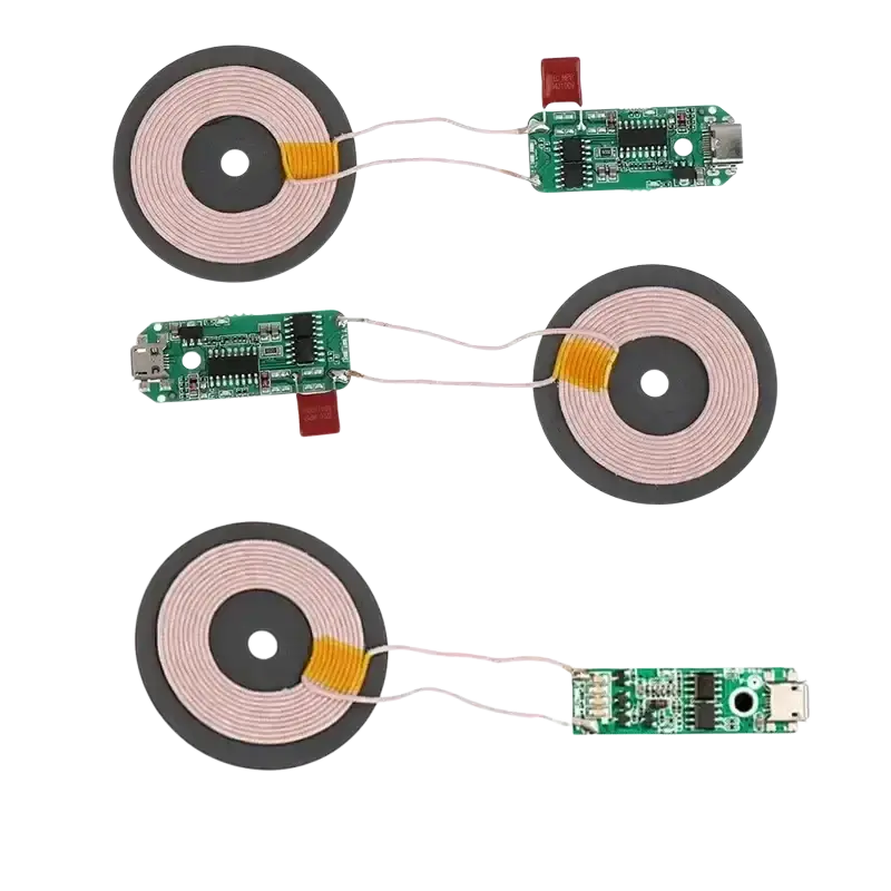 Wireless charger diy transmitter module circuit board with green coils and orange connectors for wireless charging future