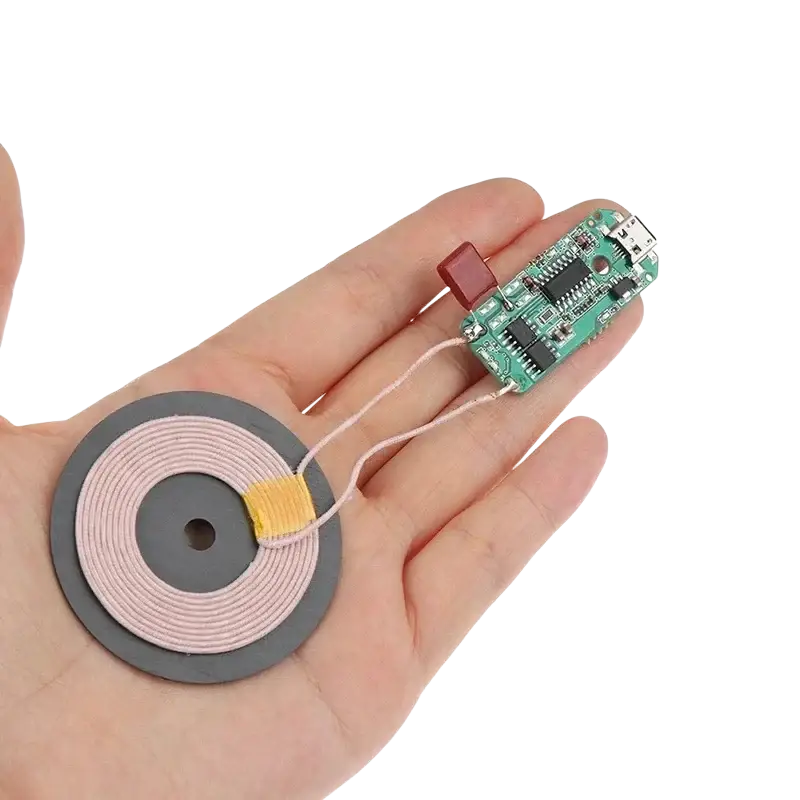 Wireless charger diy transmitter module circuit board with circular pink coils on gray base for wireless charging future