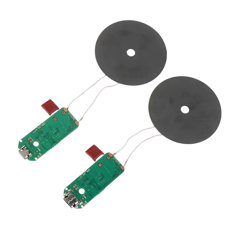 Two black circular wireless charging coils connected to green circuit boards with usb ports on wireless charger diy transmitter module circuit board