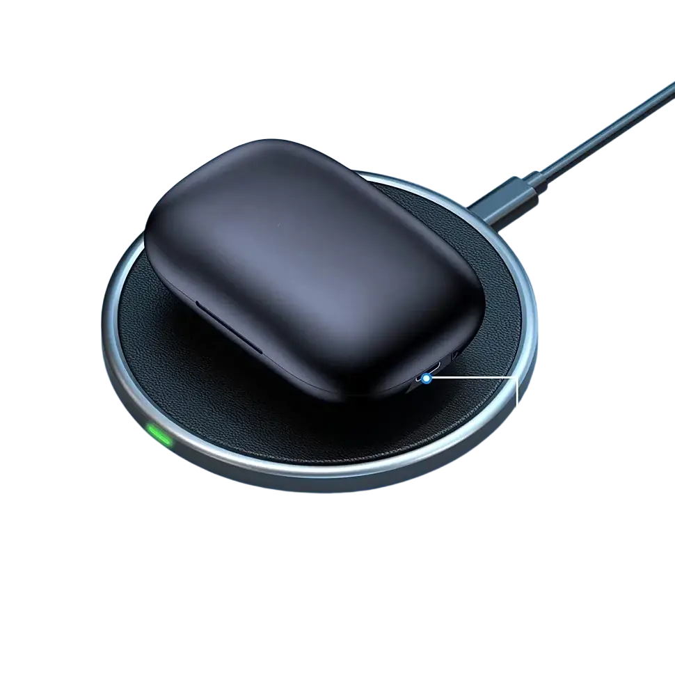 Black wireless earbuds charging case resting on a circular wireless charging pad with a silver rim and textured surface