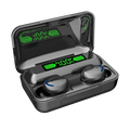 Black wireless earbuds with blue accents rest inside a matte charging case featuring glowing green led battery indicators