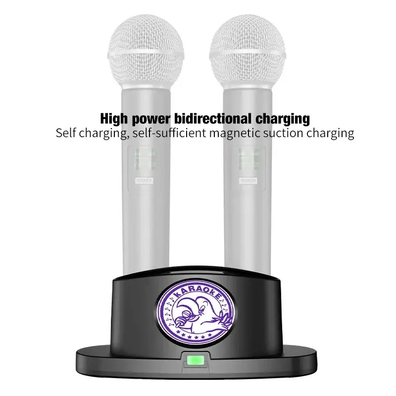 Two silver wireless karaoke microphones with mesh grilles stand in a black dual dock charging stand with purple logo