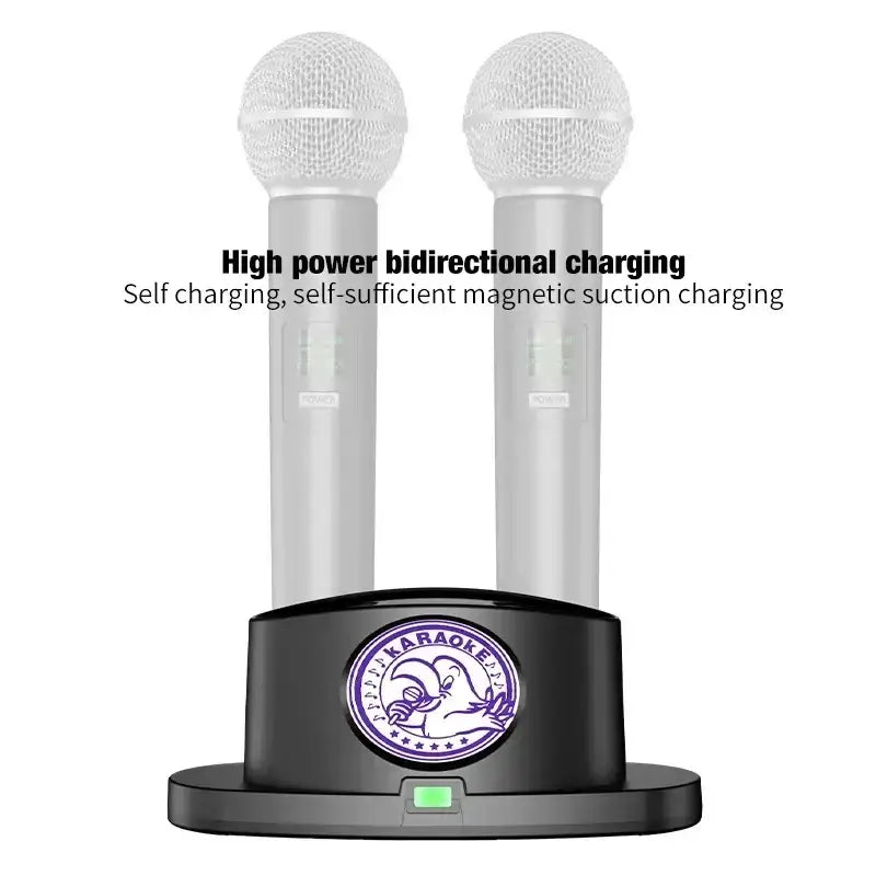 Two silver wireless karaoke microphones with mesh grilles stand in a black dual charging stand with purple karaoke logo