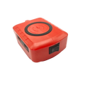Red rectangular wireless power bank with black charging pad and power switch featuring fast charging protocol for makita dewalt milwaukee 18v