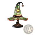 A vibrant green stained glass witch hat lamp with golden sun motif and star accents on an ornate black base