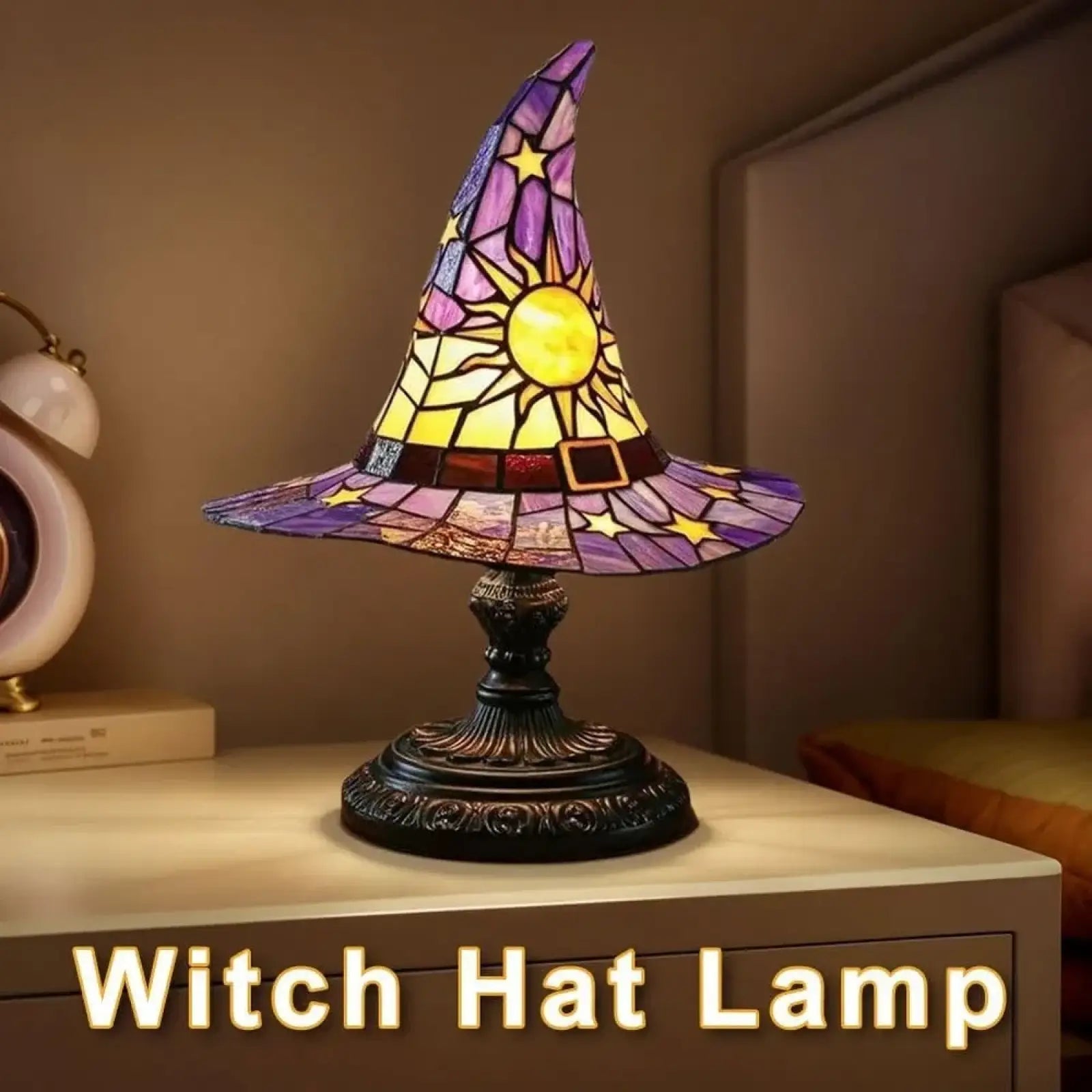 A witch hat stained glass lamp with a vibrant purple yellow and gold sun motif for gothic Halloween decor