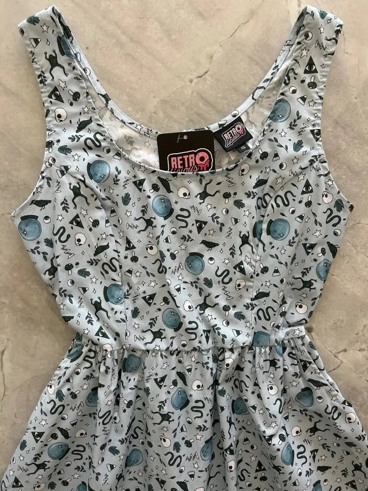 Witching hour gray retro fit and flare cotton dress featuring a light gray sleeveless design with black and teal alien graphics