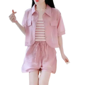 Women 2 piece summer short set featuring a pink short-sleeved button-up shirt with chest pockets and button closure