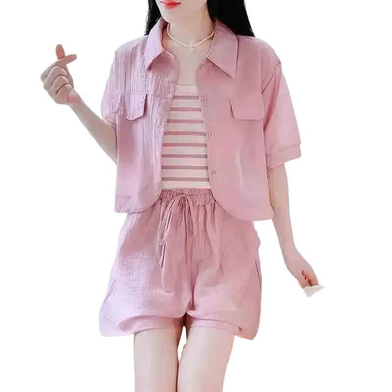 Women 2 piece summer short set featuring a pink short-sleeved button-up shirt with chest pockets and button closure