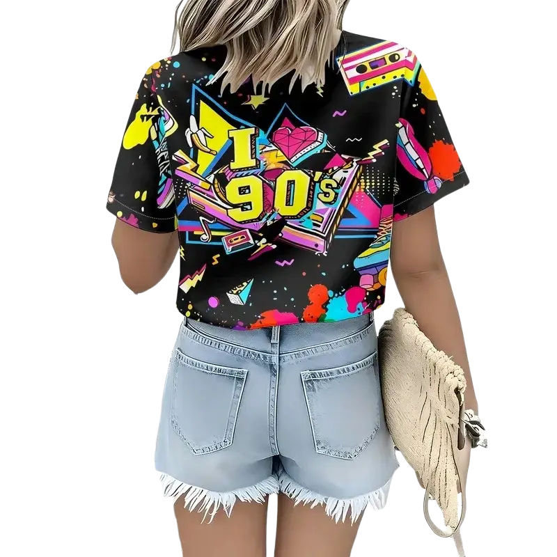 Black short-sleeved crop top featuring vibrant 90s-themed graphic with cassette tapes neon colors and bold yellow lettering