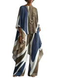 A flowing wide-legged pantsuit in bold abstract navy blue beige and white print for women two piece outfit set