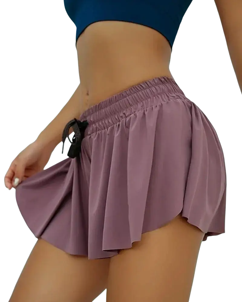 Women athletic pleated skort in purple quick dry fabric with elastic waistband and black drawstring for sports use