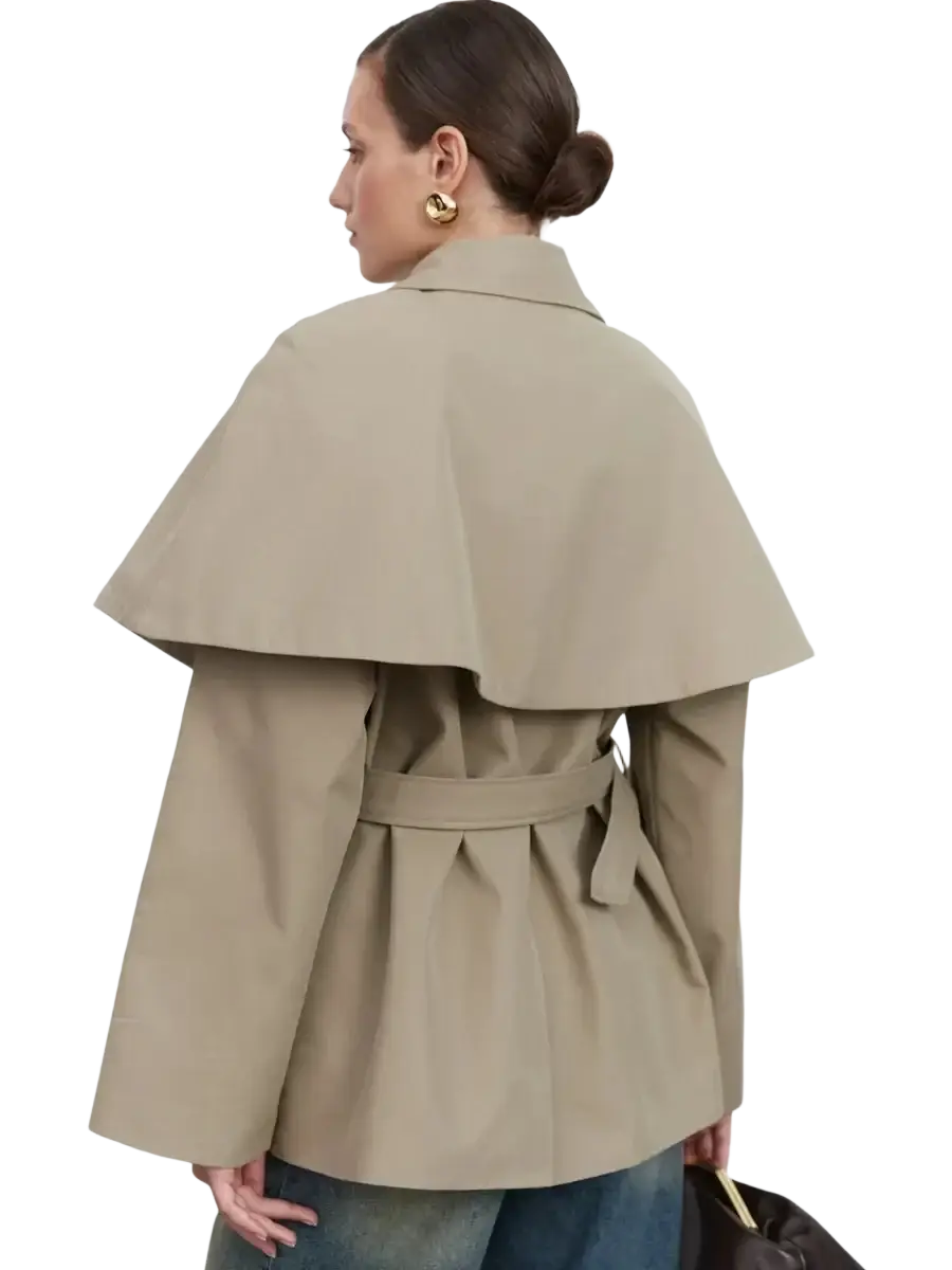 Beige women belted trench coat with wide layered cape collar and matching belt, shown from the back side
