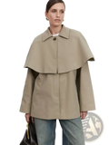 Beige women belted trench coat with cape overlay featuring double-layered flared collar and long sleeves