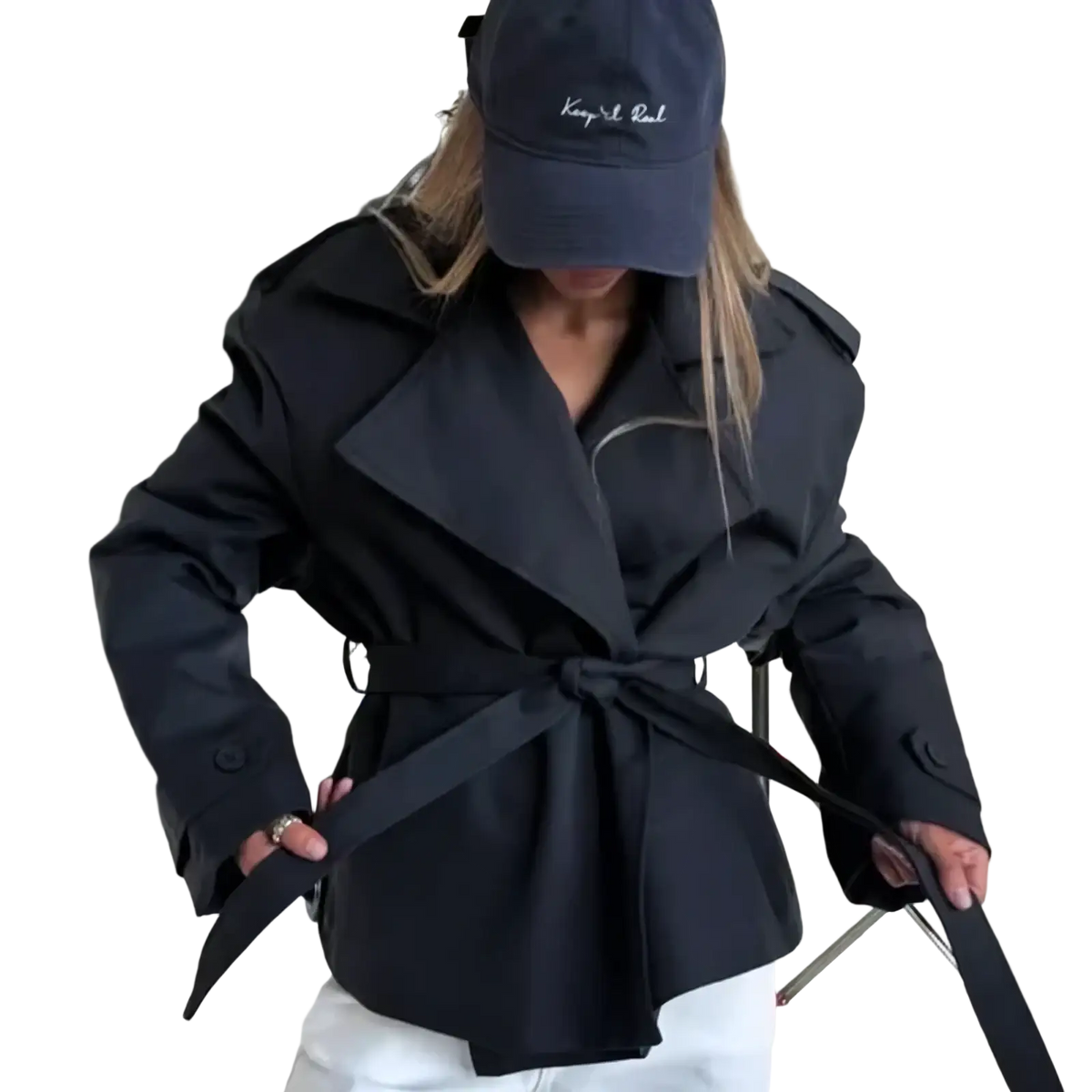 Black belted trench coat with structured collar and shoulder pads offering casual chic outerwear for women