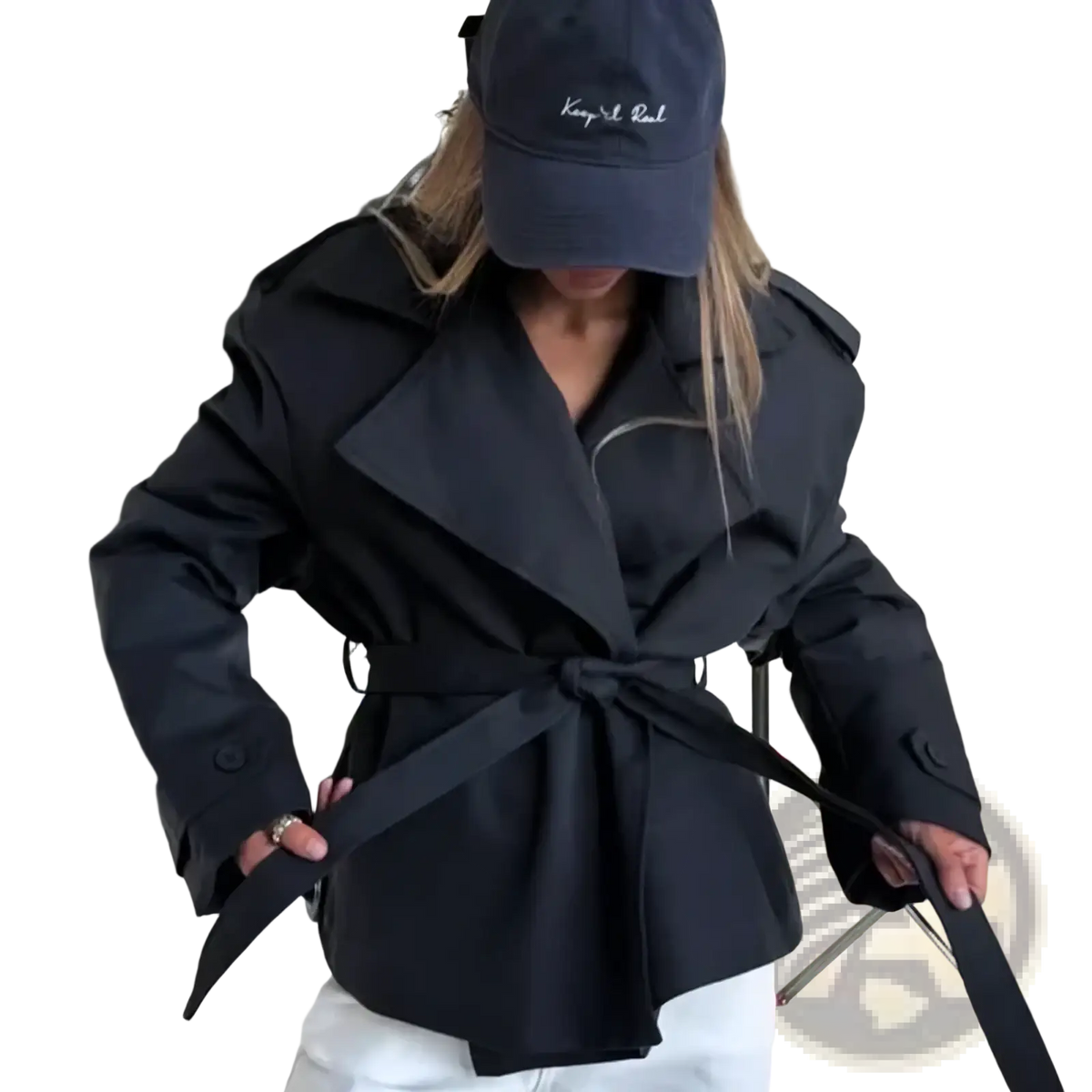 Black belted trench coat with structured collar and shoulder pads offering casual chic outerwear for women