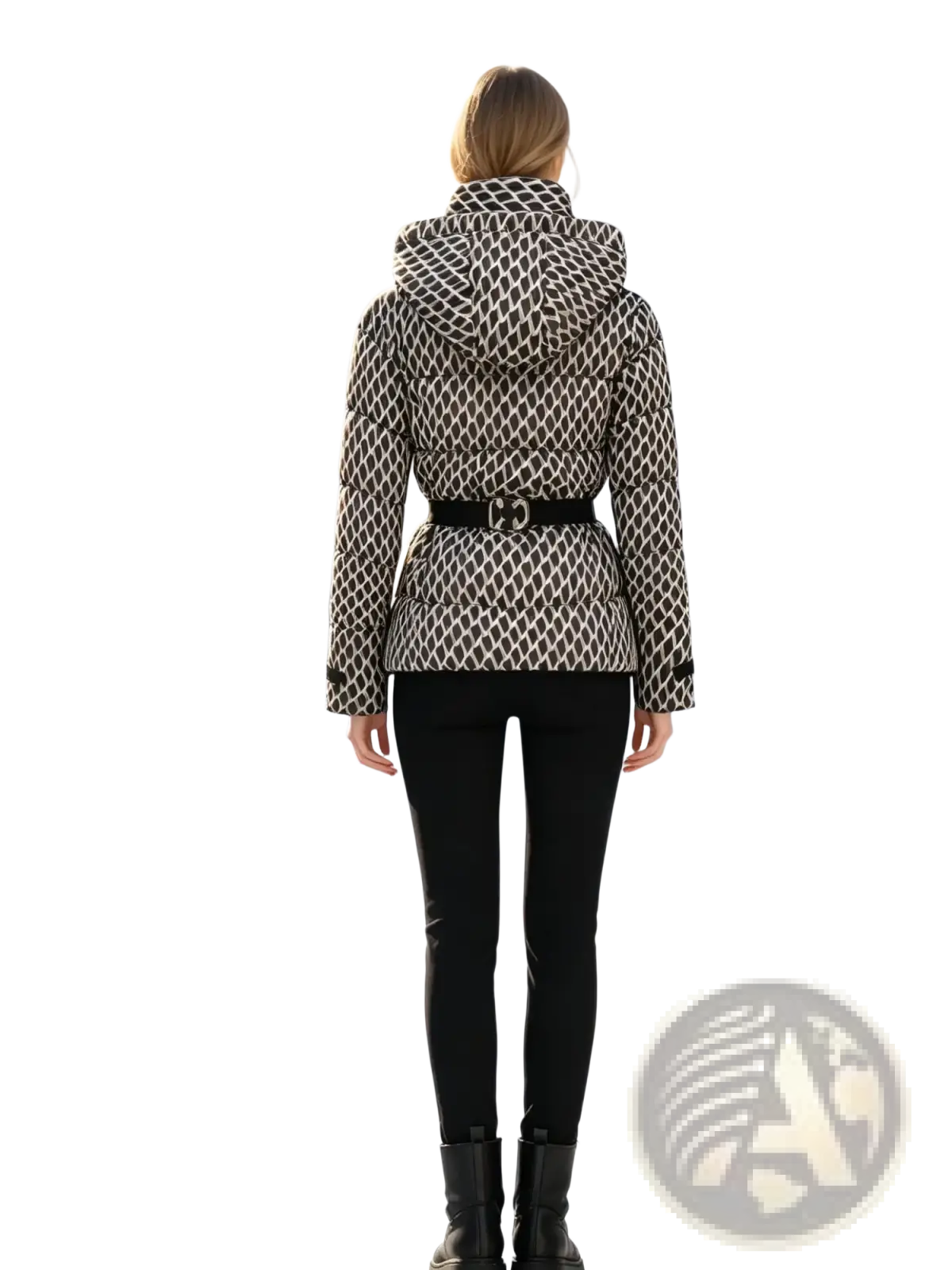 A woman wears a black and white geometric patterned women belted winter puffer jacket with detachable hood