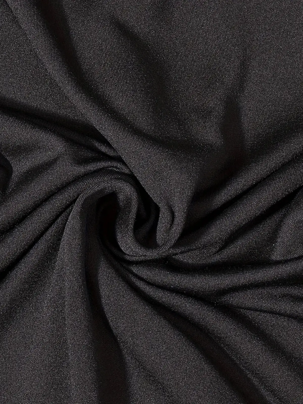 Women black bodycon jumpsuit short sleeve featuring black textured fabric with subtle sheen and fine uniform weave
