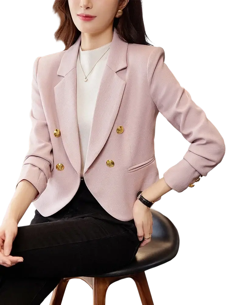 A soft pink double-breasted tailored blazer with gold-toned buttons for women in a formal fit