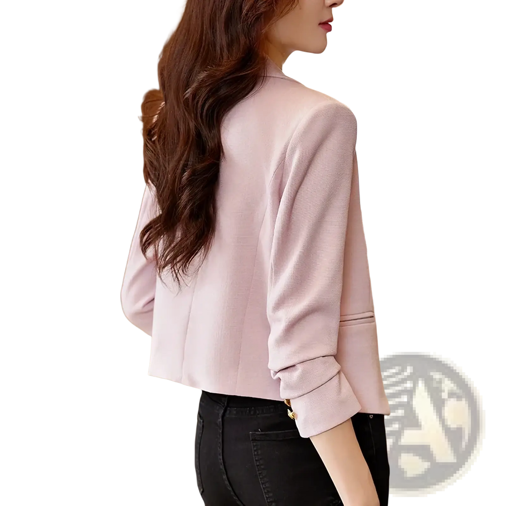 Women black double breasted blazer with gold buttons featuring soft pink textured fabric and rolled cuffs