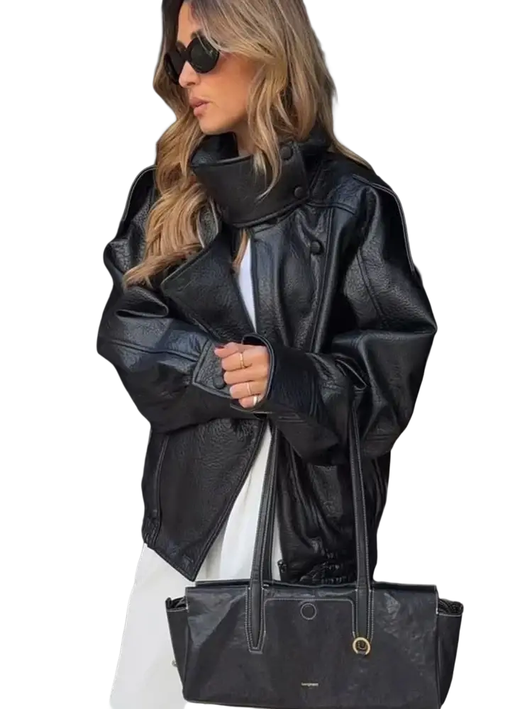 Black leather tote bag with gold-tone hardware and structured design complementing women black faux leather moto jacket