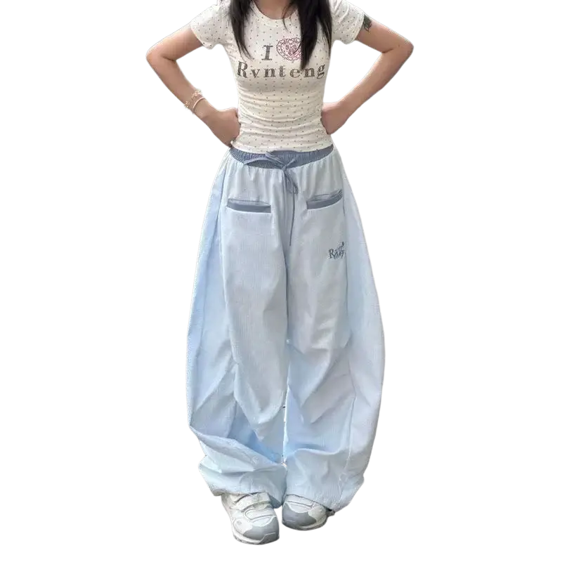Light blue women cargo pants with wide-leg baggy fit, drawstring waist, and front pockets for streetwear style