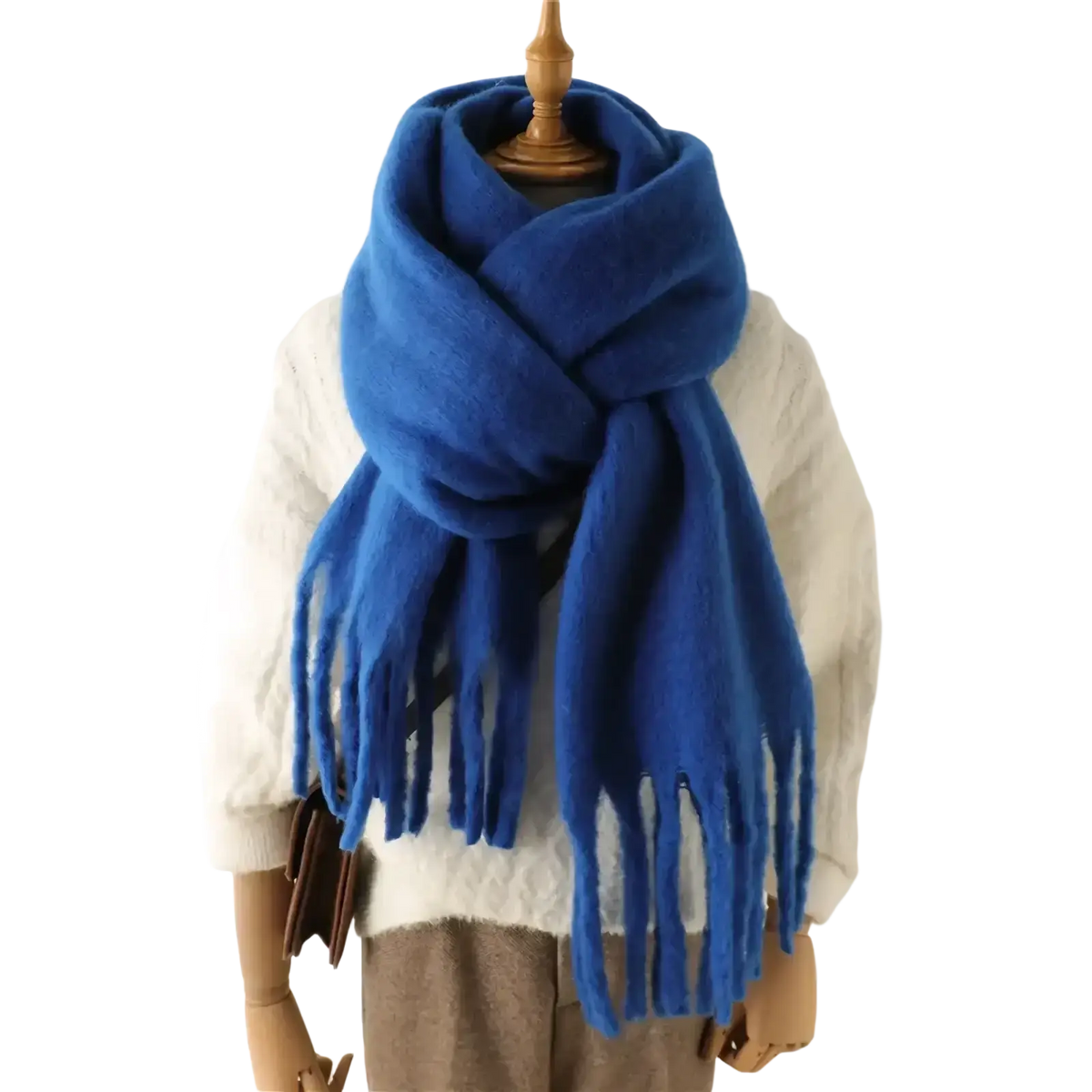 A royal blue plush women cashmere feel winter scarf with soft fringed ends draped around a mannequin