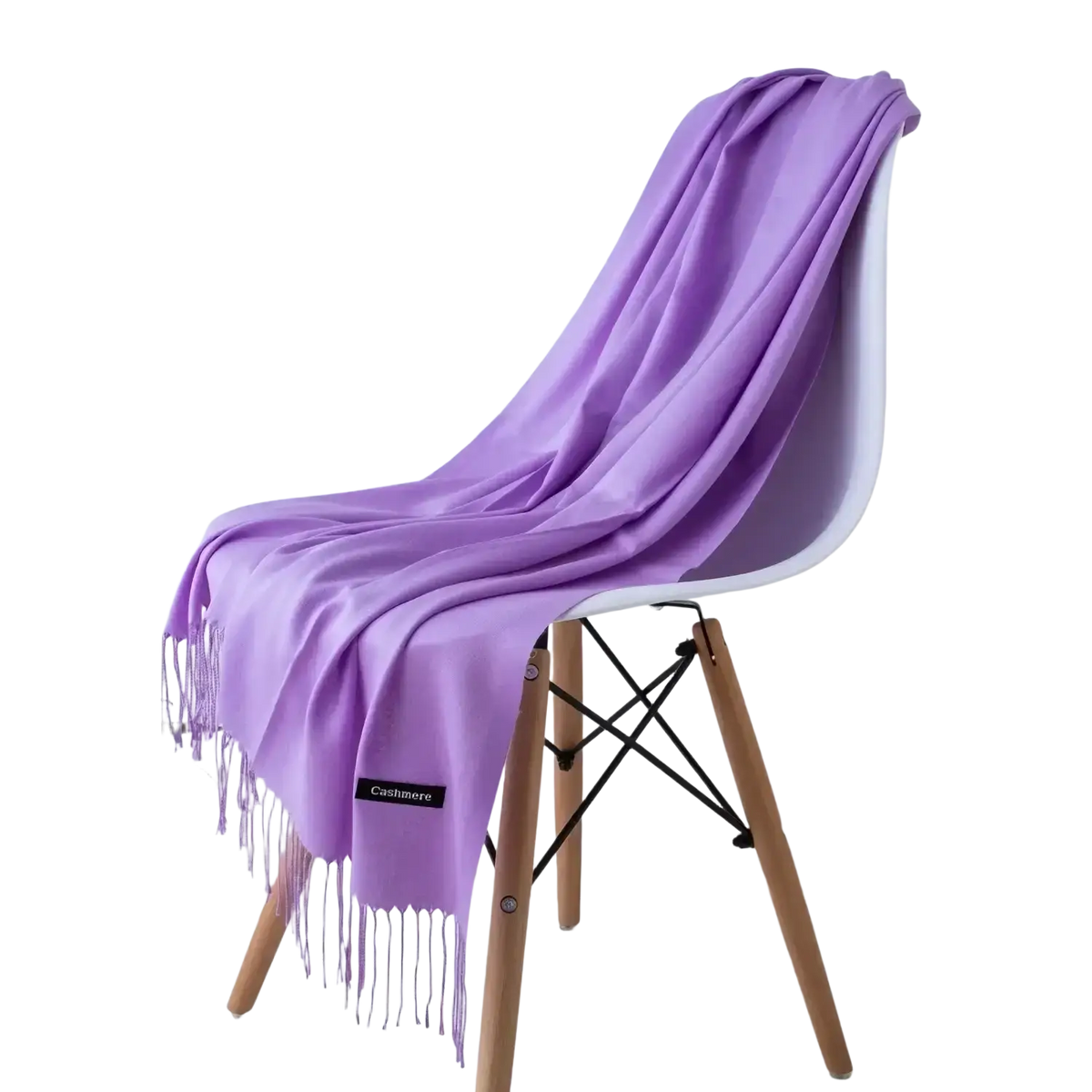 A soft lavender cashmere feel winter scarf with delicate fringe elegantly draped over a modern chair
