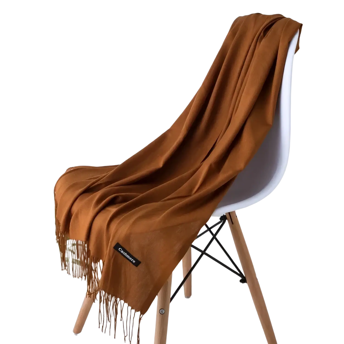 A soft rust-colored cashmere feel winter scarf shawl with delicate fringe and a small black brand tag